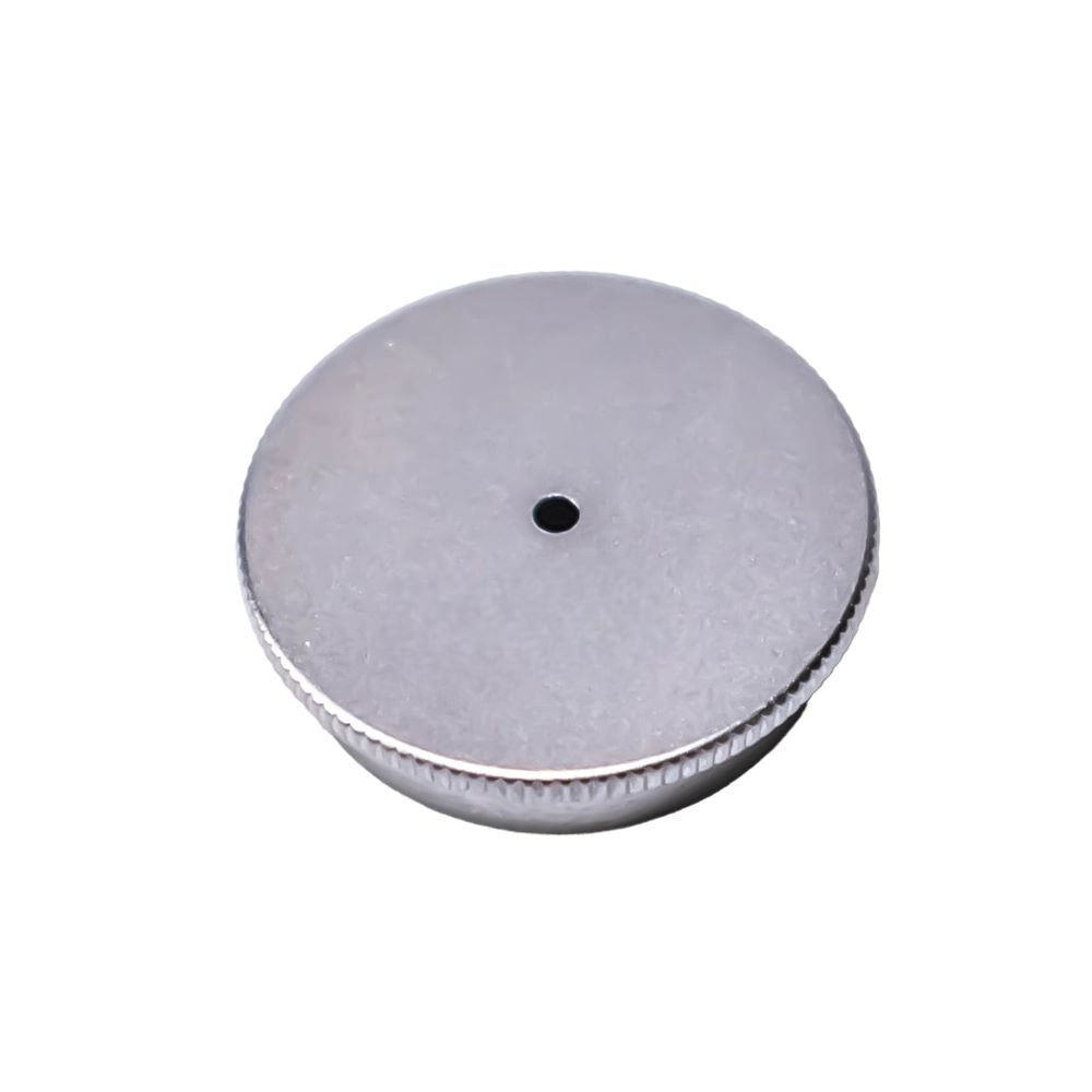Silver circular metal cap with a central hole and knurled edge