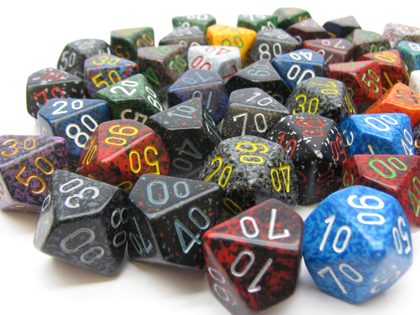 A pile of many colorful, speckled percentile dice scattered on a white surface.