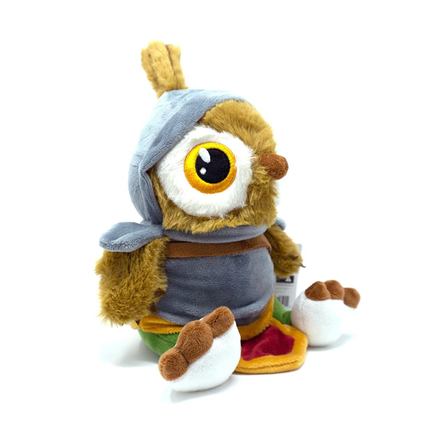 Fluffy brown creature plush, with one large yellow eye, wearing a blue hooded cloak and grey tunic, sitting.