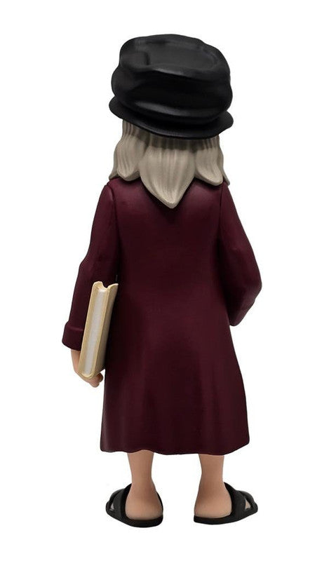 Back view of Minix Historical Leonardo da Vinci 67 collectible figure with grey beard black hat long maroon robe and tan tunic holding a book wearing sandals