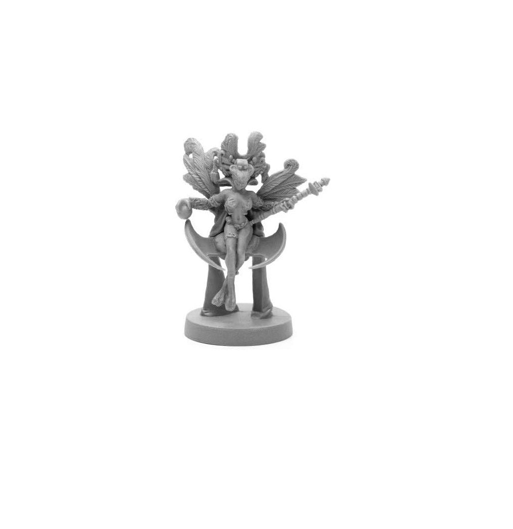 Grey miniature of a winged female figure sitting on a crescent blade, holding a staff