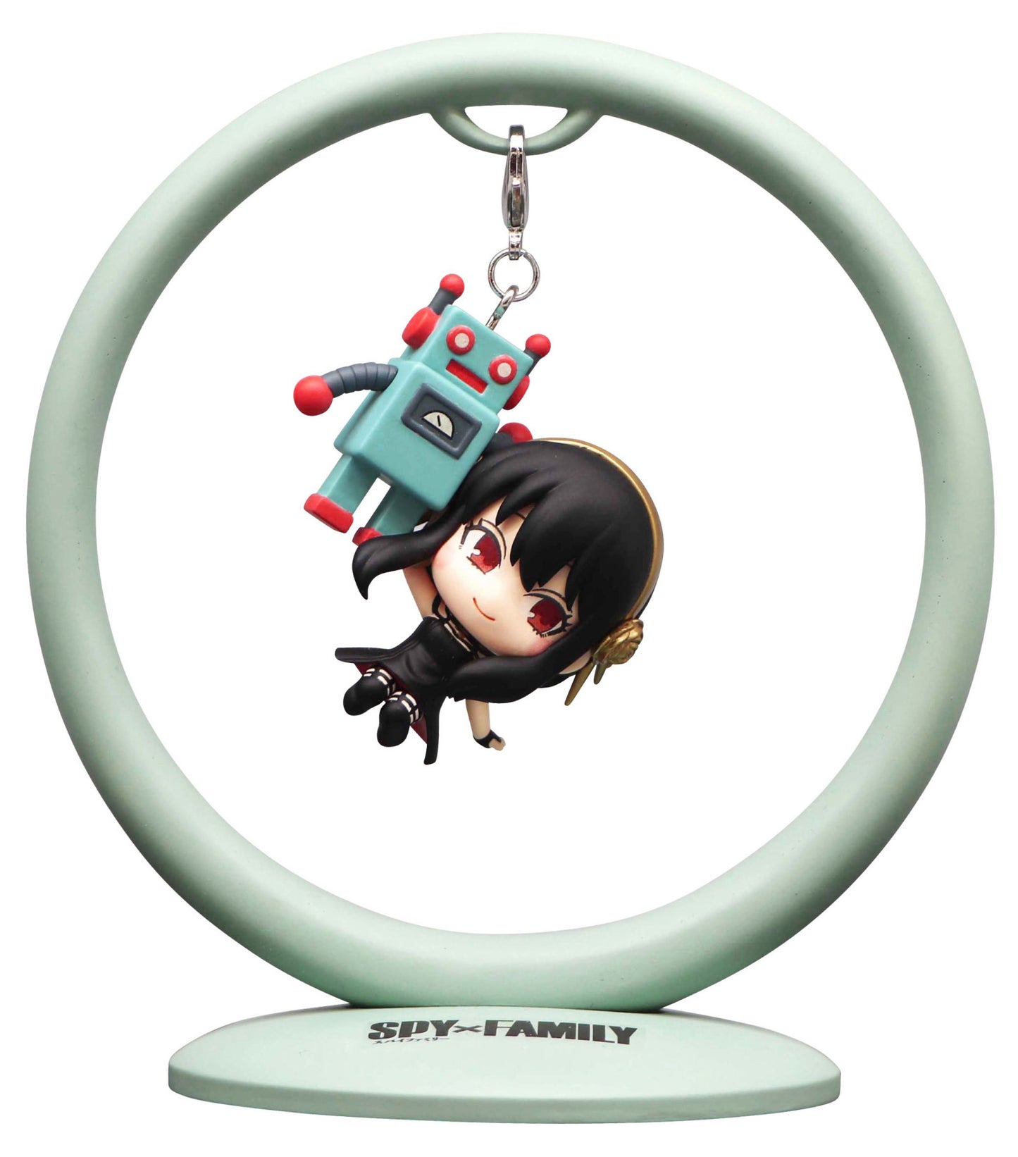 A Spy x Family chibi figure of Yor Forger holding a small blue robot suspended from a light green circular stand