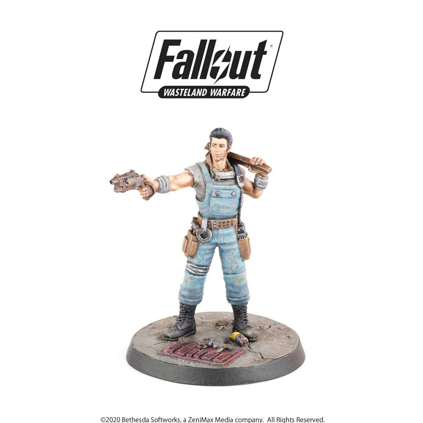 Fallout Wasteland Warfare miniature: Male figure in blue overalls aims a pistol and carries a wooden club
