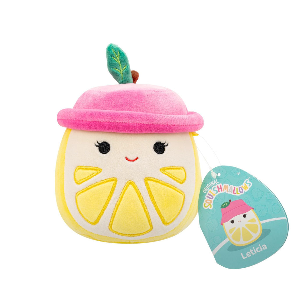 Leticia, a yellow and white lemon Squishmallow plush with a pink hat, green leaf, and happy embroidered face