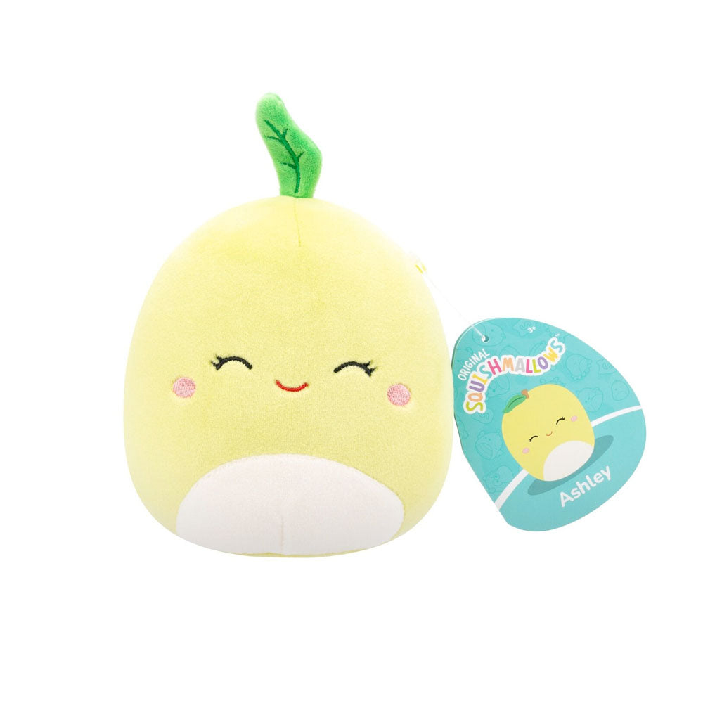Yellow Squishmallow plush toy, Ashley the lemon, with a green leaf, white belly, and smiling face, displayed with its tag