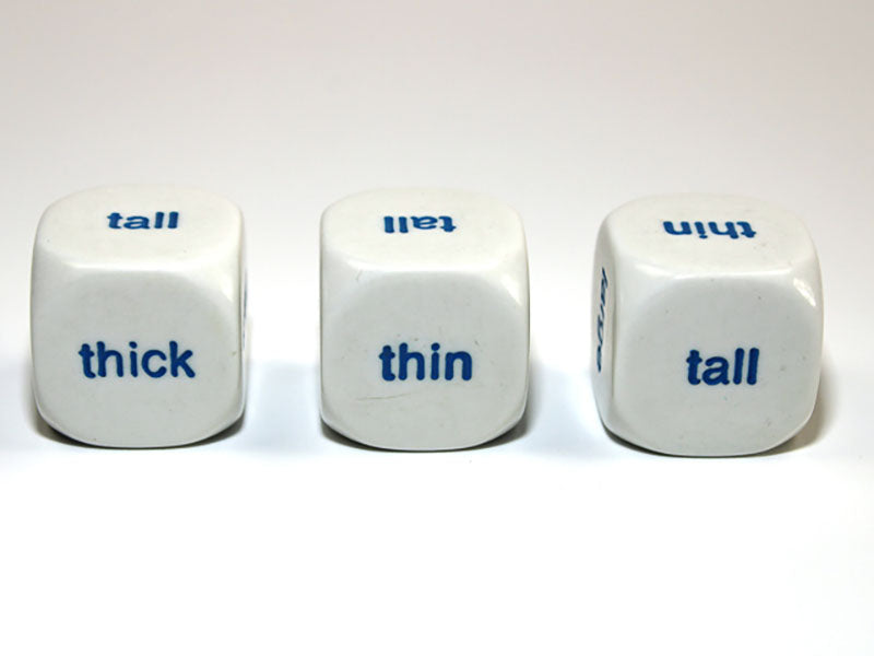 Three white cubes with blue words 'thick', 'thin', and 'tall'
