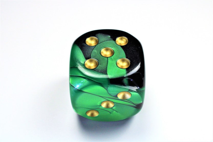 Black and Green and Gold die showing 5 and 3 faces with gold pips visible, on a white background