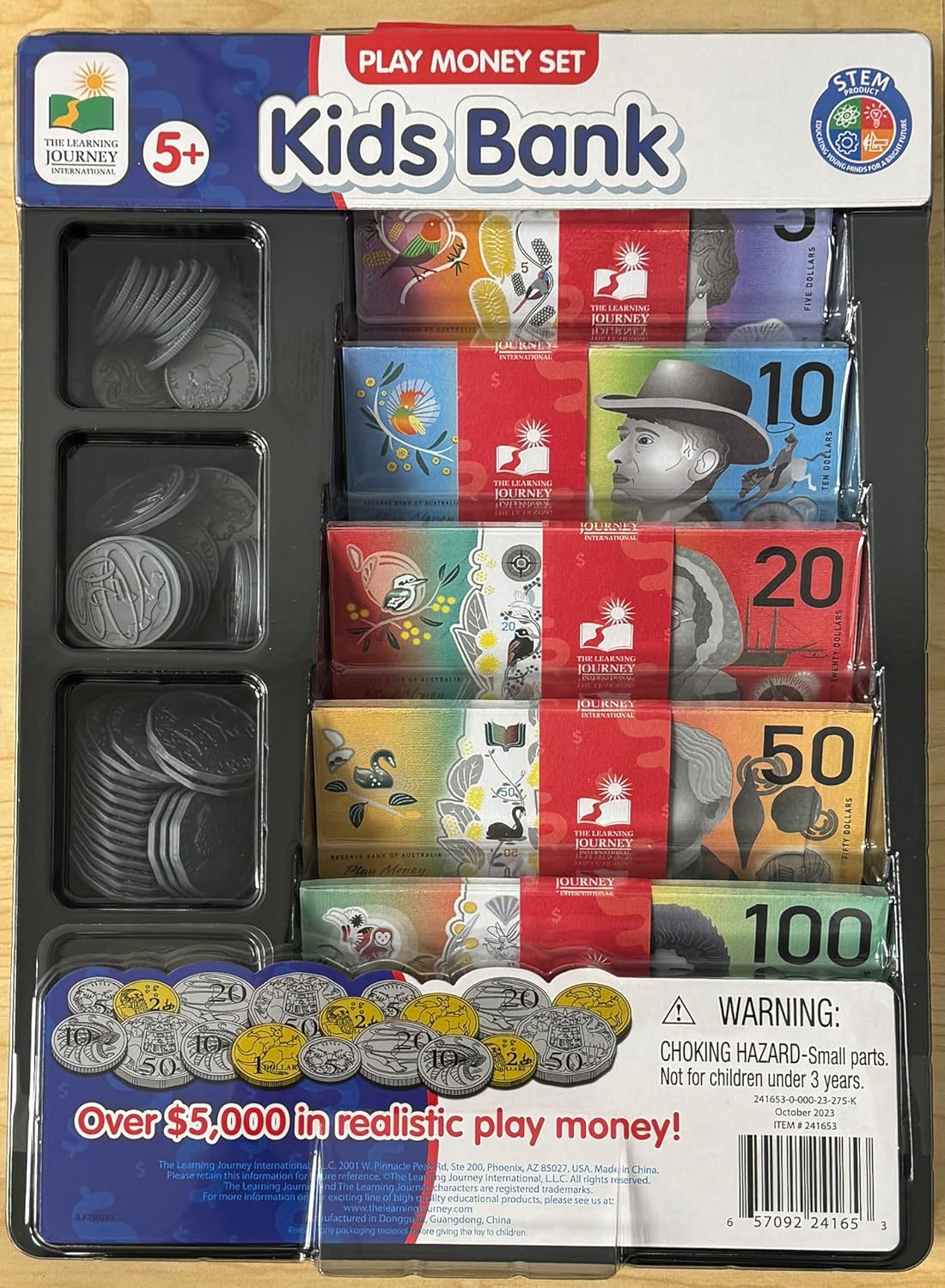 Kids Bank play money set package showing stacks of plastic coins and realistic, colourful play banknotes ($5, $10, $20, $50, $100) for education