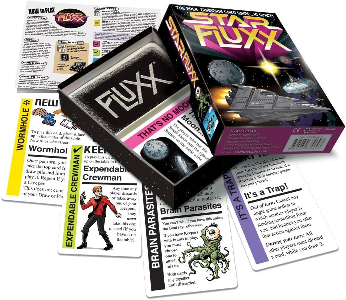 Star Fluxx sci-fi card game box, open to show branded cards, rule sheet, and various game cards with spaceships and alien creatures.
