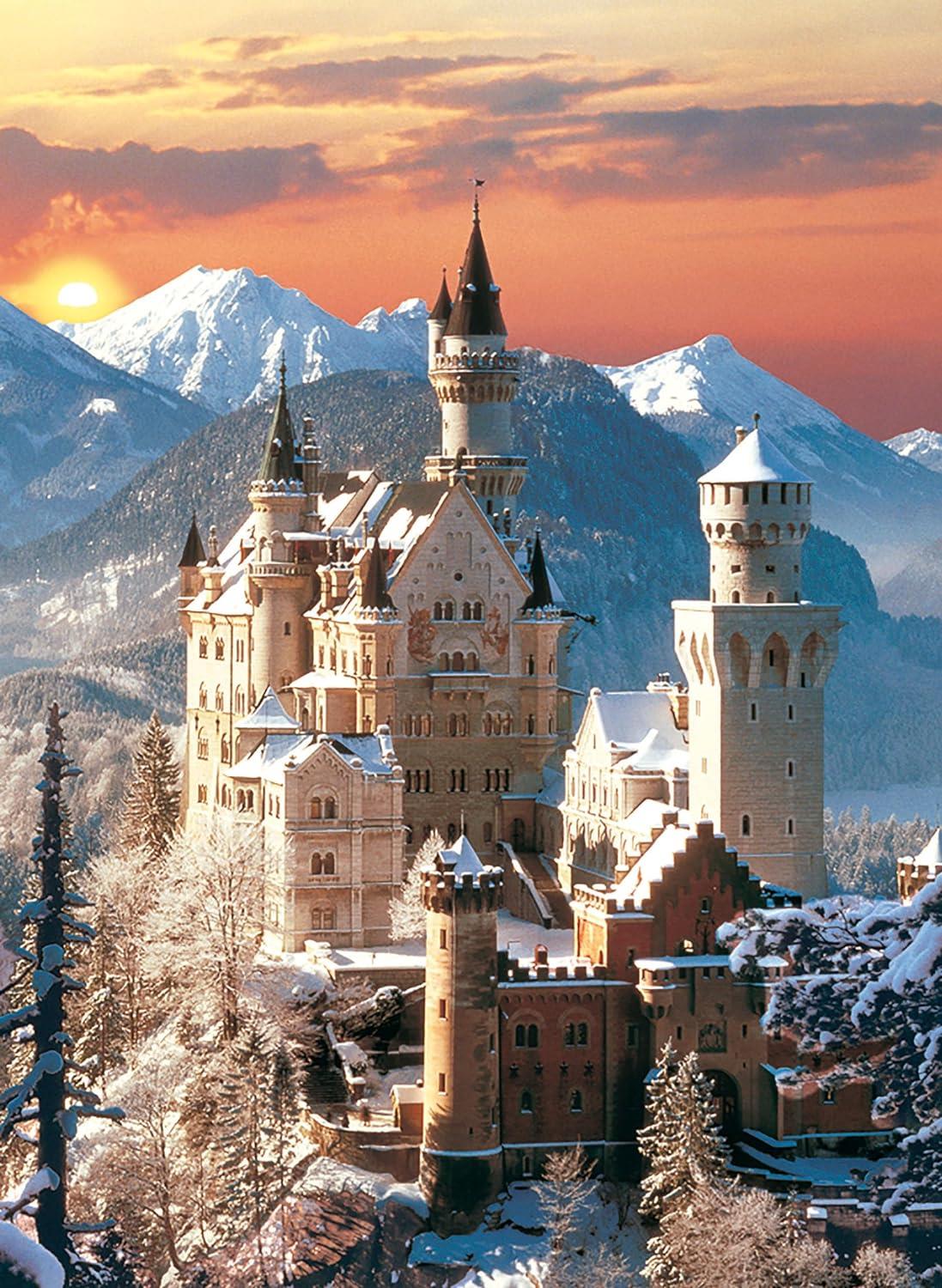 High-quality image of the German Neuschwanstein Castle in deep winter snow with towering mountains and a dramatic orange sunset