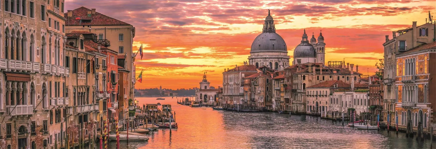 High-quality 1000-piece jigsaw puzzle image depicting the Grand Canal Venice lined with ancient architecture under a dramatic orange sunset