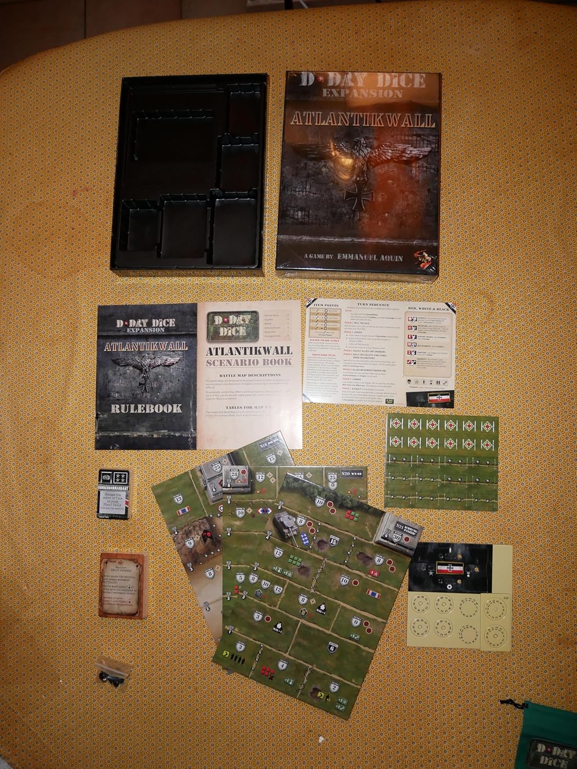 D-Day Dice: Atlantikwall board game expansion unboxed, showing its box, rulebooks, green battle maps, cards, and tokens