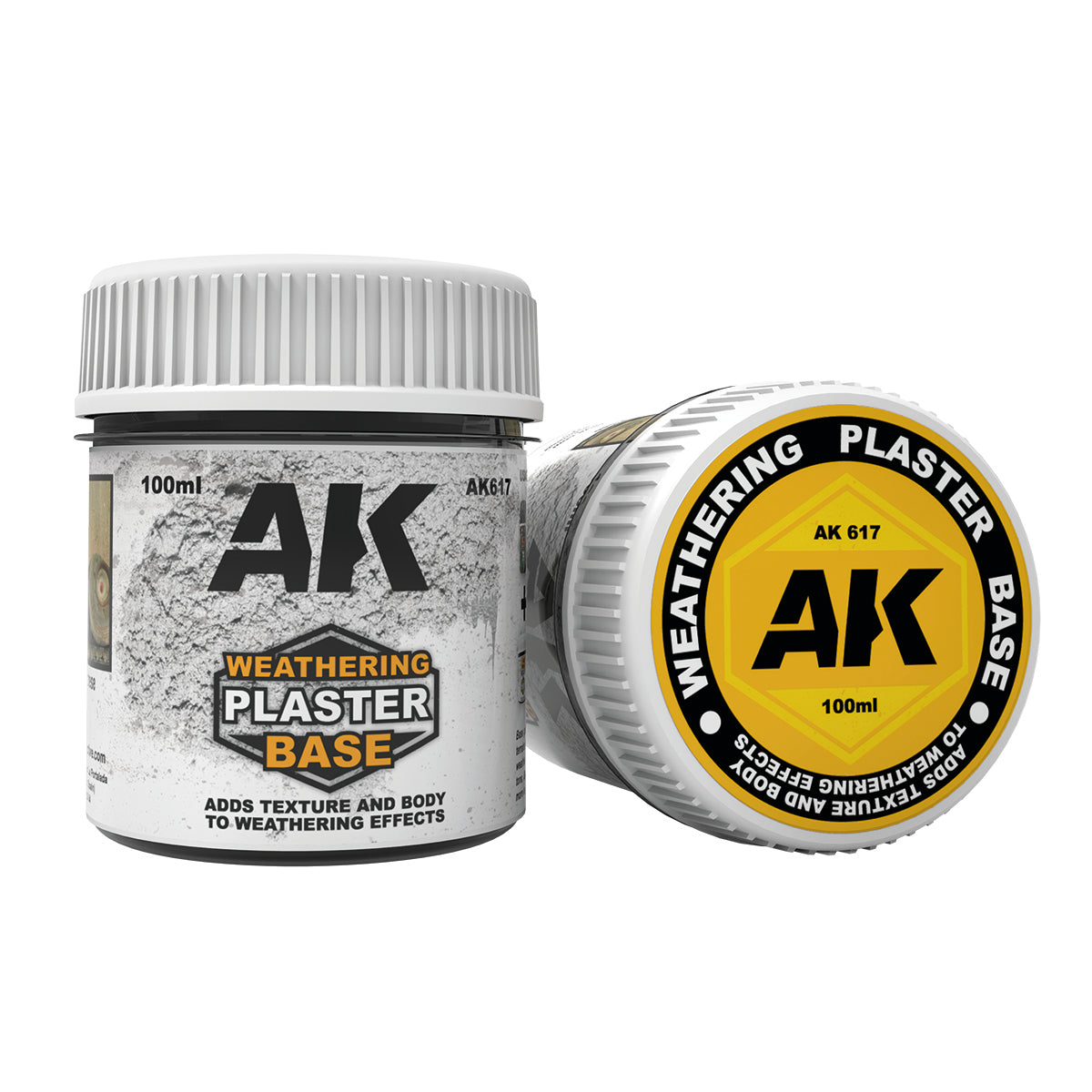 Two white 100ml AK Weathering Plaster Base containers for adding texture. One stands, one lies showing its yellow lid.