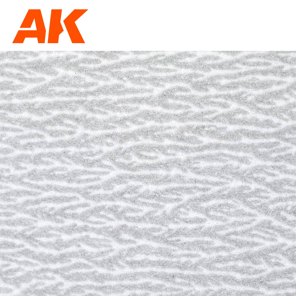 Orange AK logo above a white surface with fine, irregular grey textured patterns