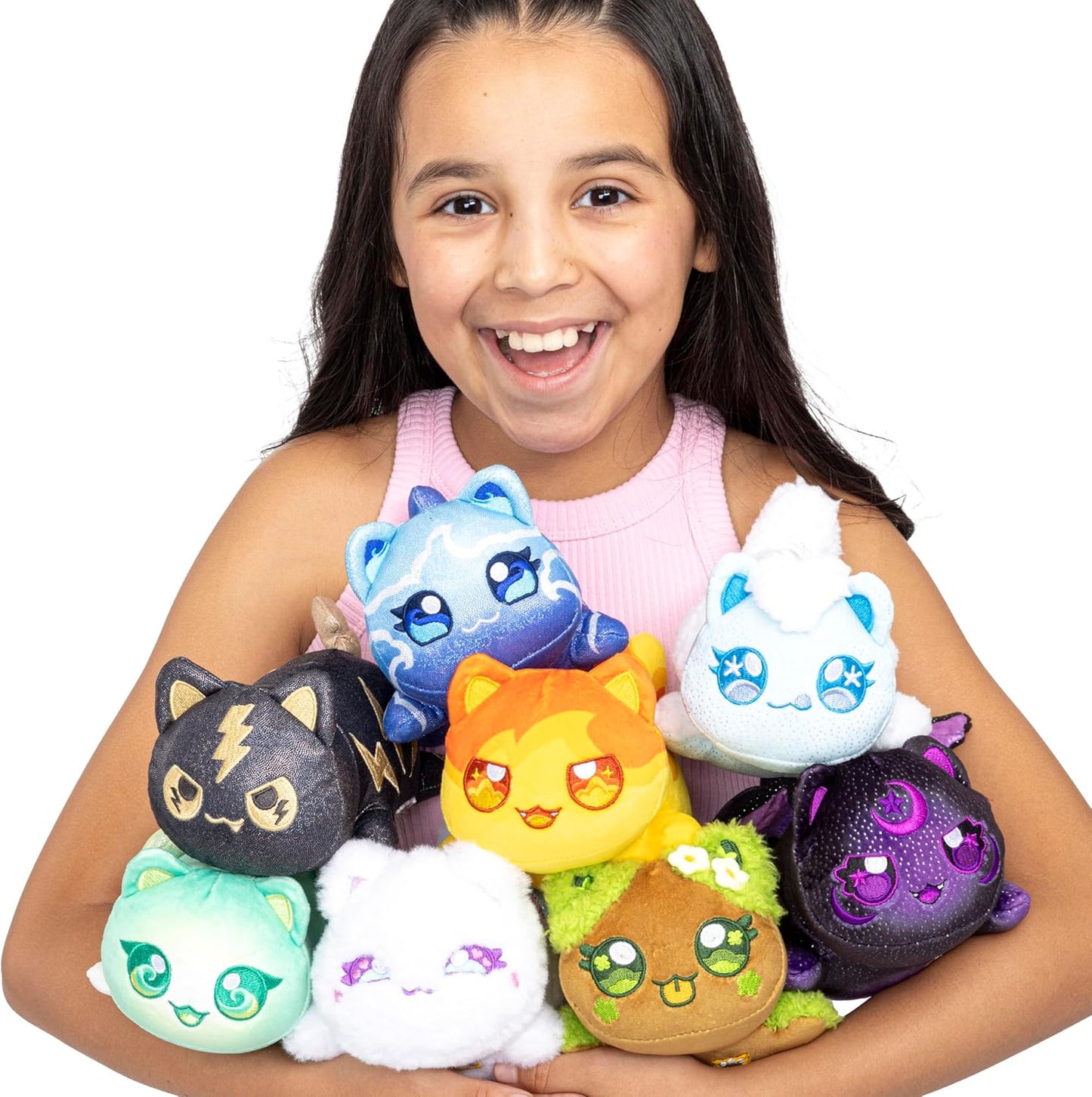 Happy girl holding several colorful, glittery cat plush toys