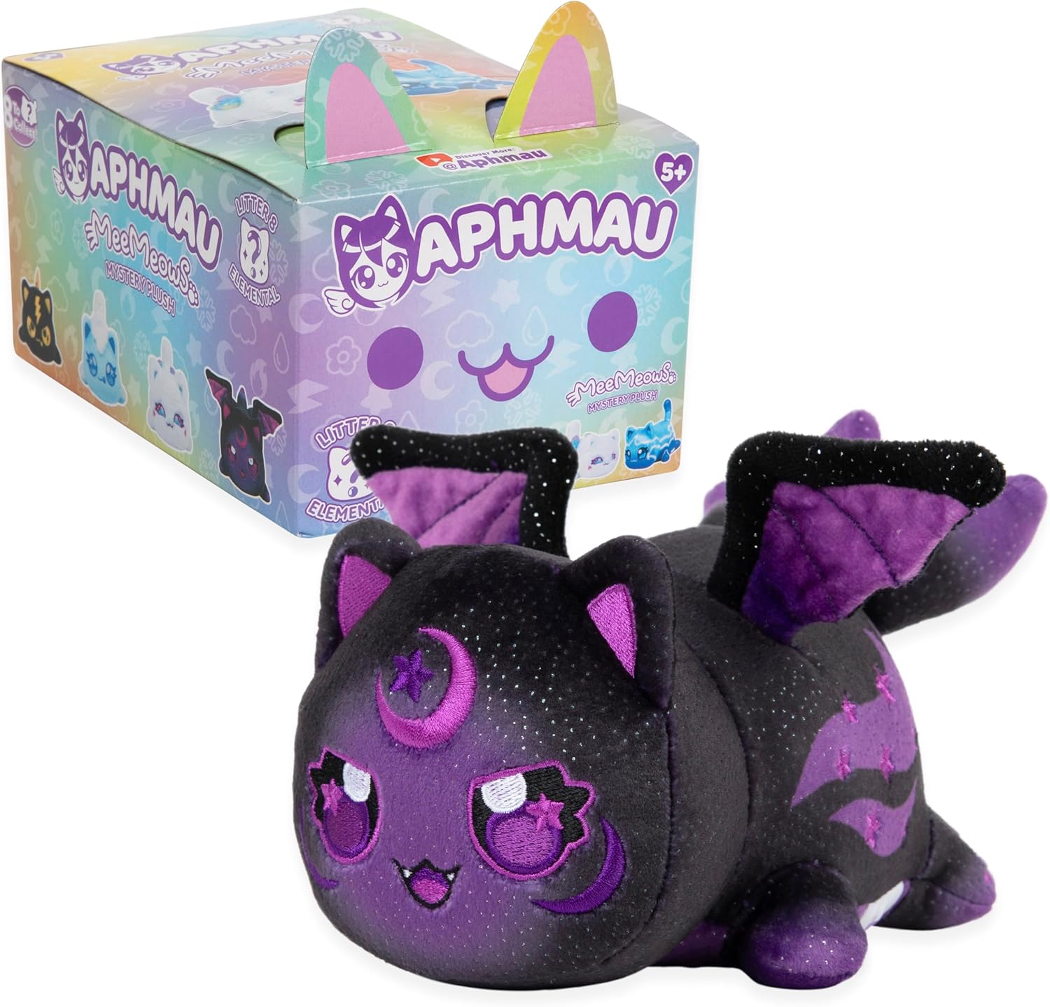 A black and purple glittery winged cat plush with crescent moons on its face, next to an Aphmau MeeMeows mystery box