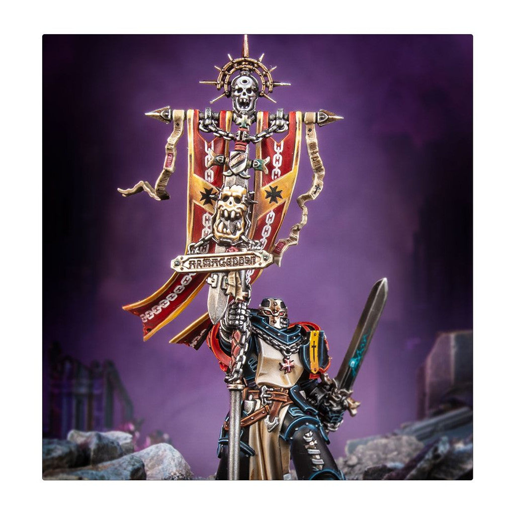 Armored miniature warrior in a skull helmet, holding an ornate banner with skulls, chains, 'ARMAGEDDON', and a glowing sword