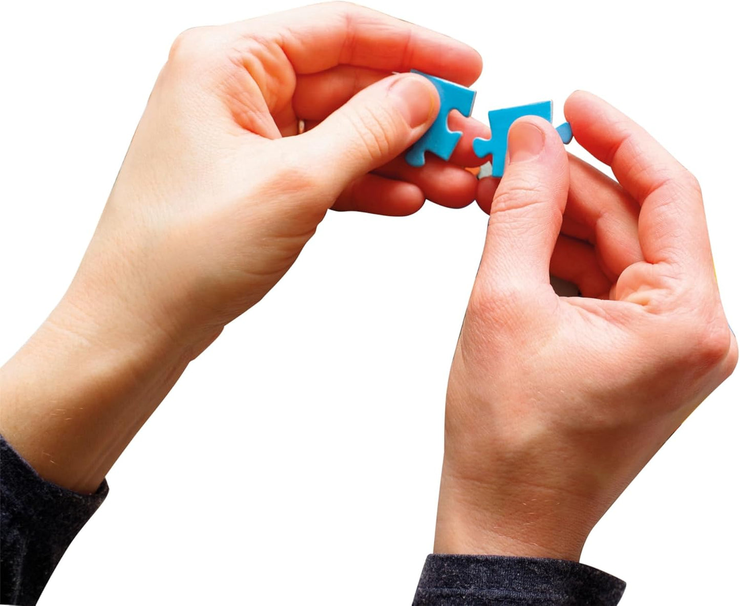 Two hands bringing together two blue puzzle pieces