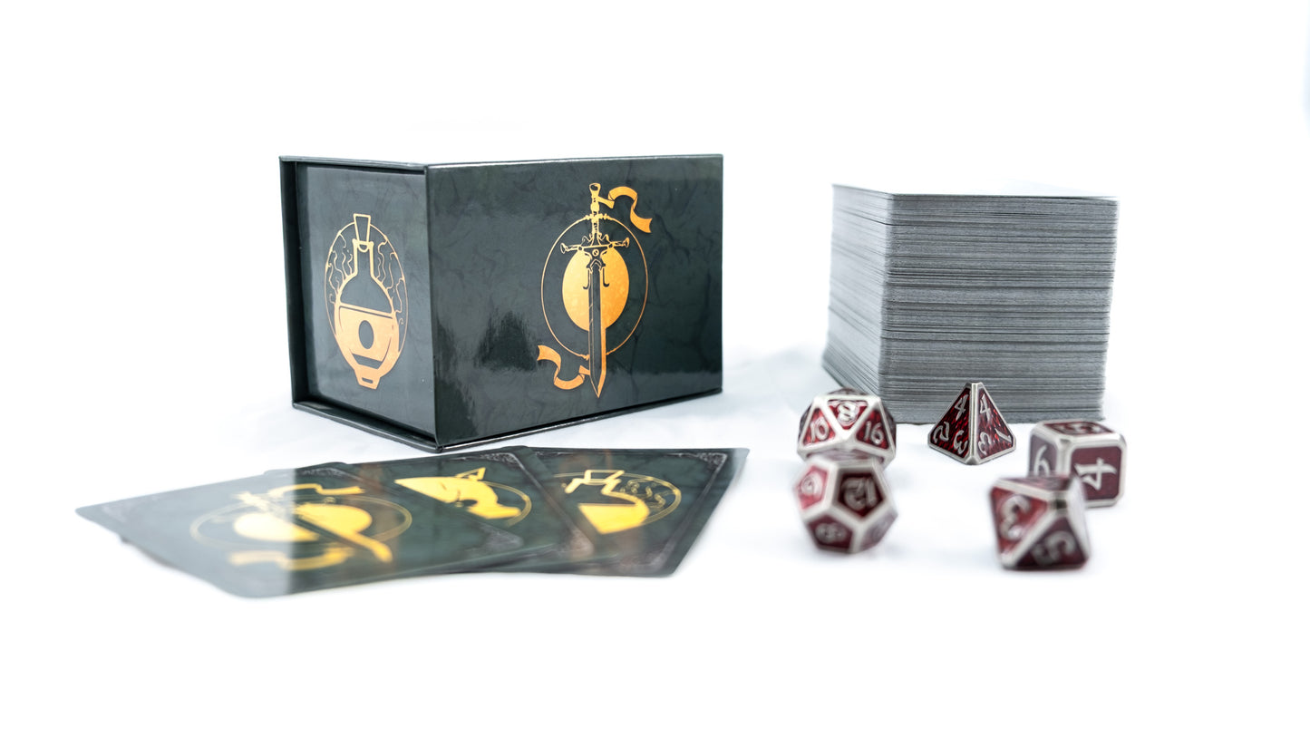 RPG game set featuring a black box, stack of playing cards, and a collection of silver and red polyhedral dice