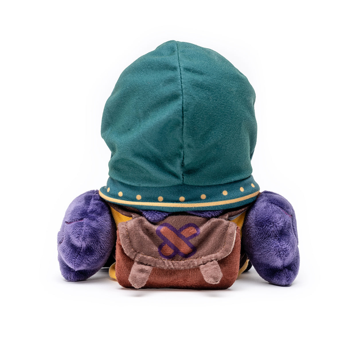 Back view of a plush toy with a green hood, purple limbs, and a brown backpack with a purple symbol
