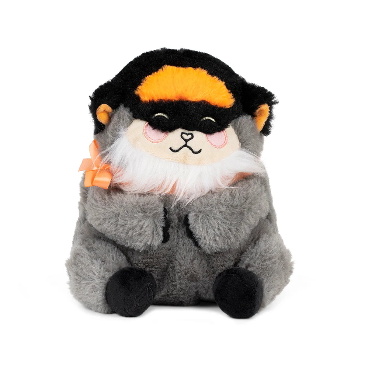 A fluffy grey animal plush with a black cap, orange stripe, white beard, closed eyes, pink cheeks, and an orange bow