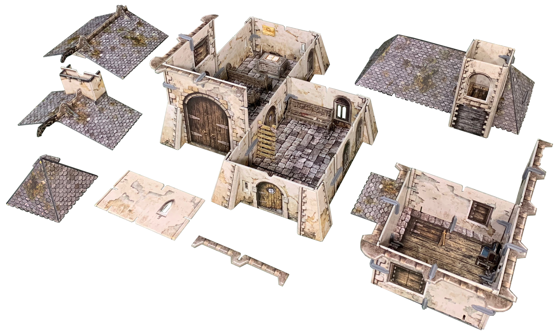 Unassembled modular medieval fantasy terrain pieces for tabletop games, showing detailed walls, shingled roofs, and room interiors.
