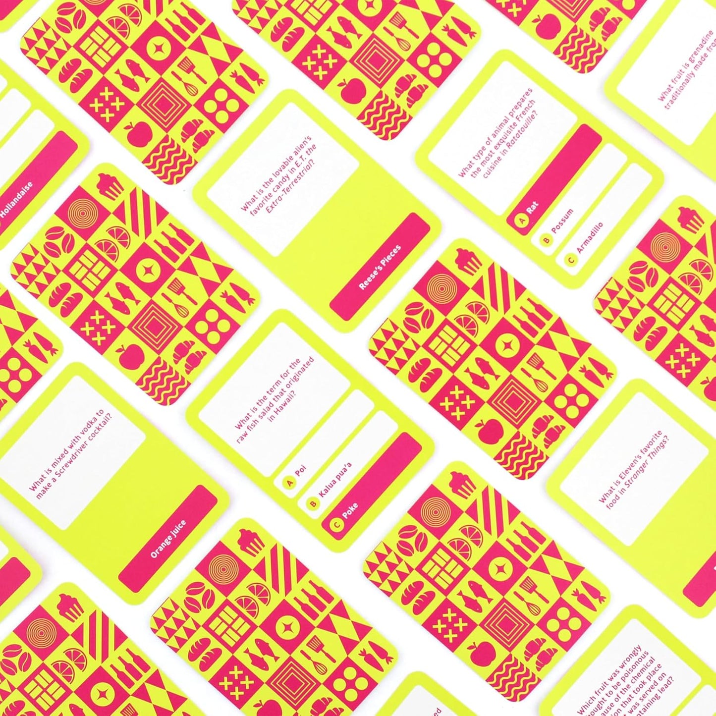 Scattered neon yellow and hot pink trivia cards with pop culture and food questions, some answers revealed