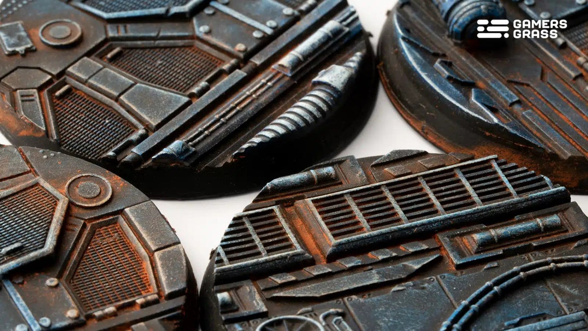 Detailed, dark industrial miniature bases with metallic textures, blue accents and heavy rust effects