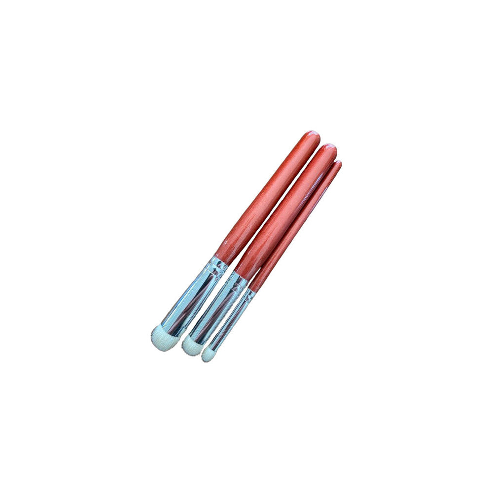 Set of 3 makeup brushes with reddish-brown handles, silver ferrules, and soft white bristles