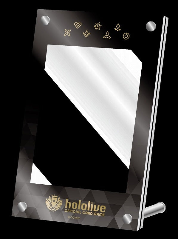 Black Hololive Official Card Game display frame with clear window, gold logo, geometric pattern, and abstract symbols on black; silver fasteners and support leg