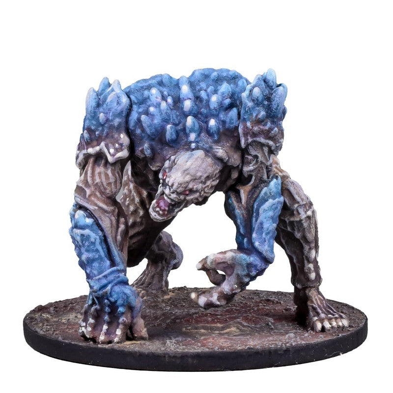A blue and grey ice monster miniature, hunched and snarling on a textured round base