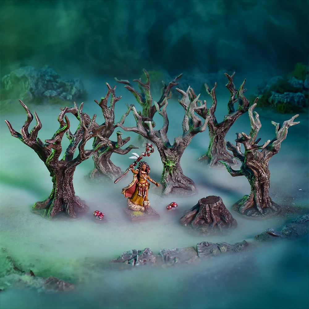 Female miniature with staff stands in a mystical, misty forest of gnarled trees, some with green glowing faces.