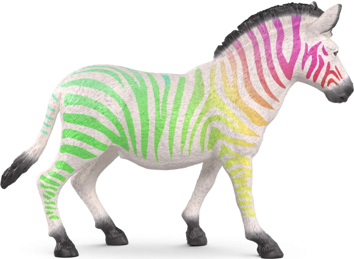 A white zebra figurine with green-to-red rainbow stripes stands on a white background