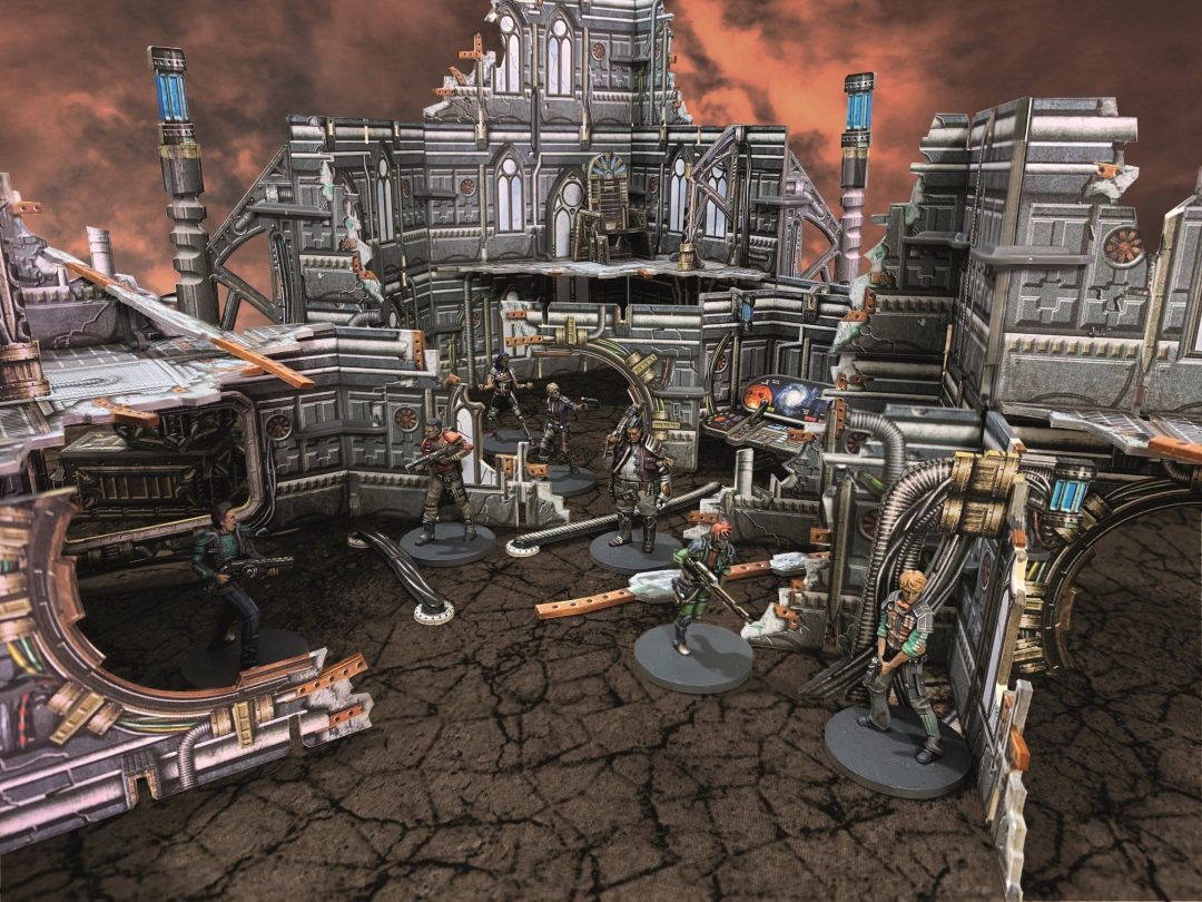 Armed sci-fi miniatures on a detailed, ruined gothic tabletop wargame battlefield under a red sky.