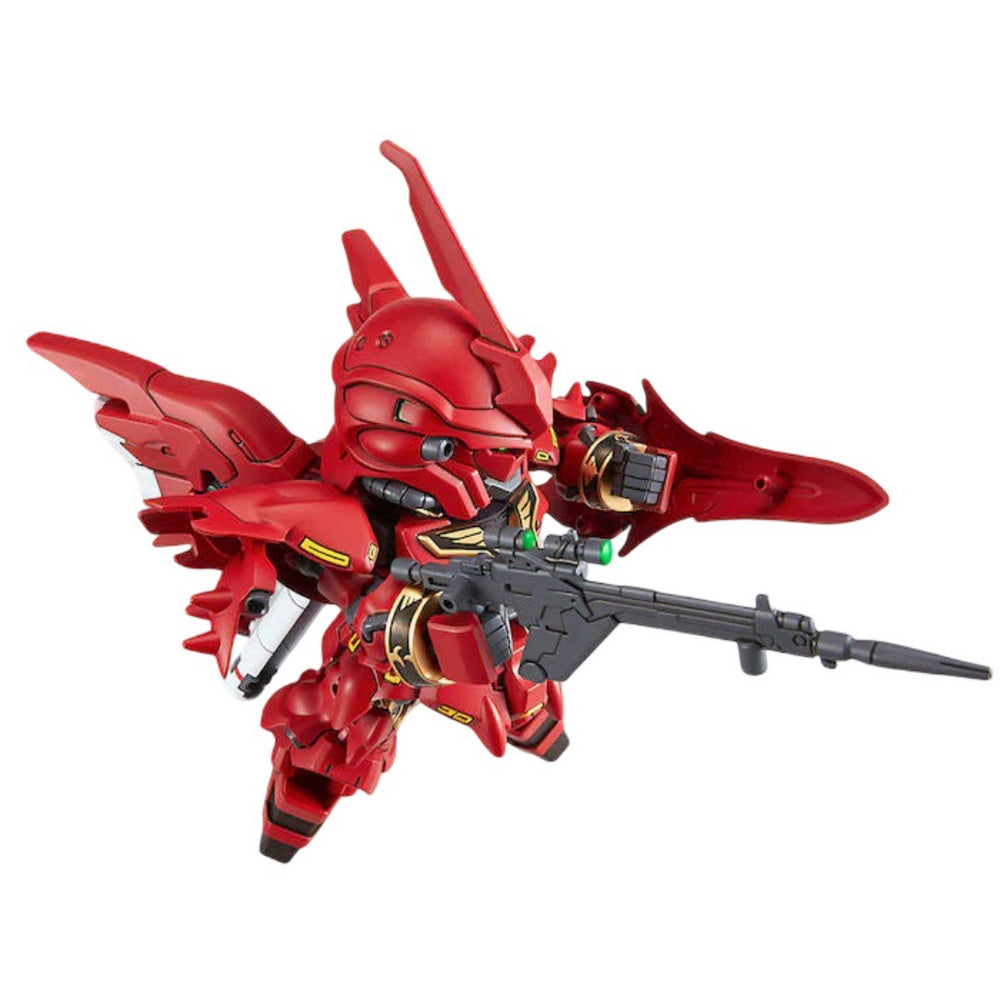Red SD Gundam figure with gold accents, holding a long rifle and a small shield