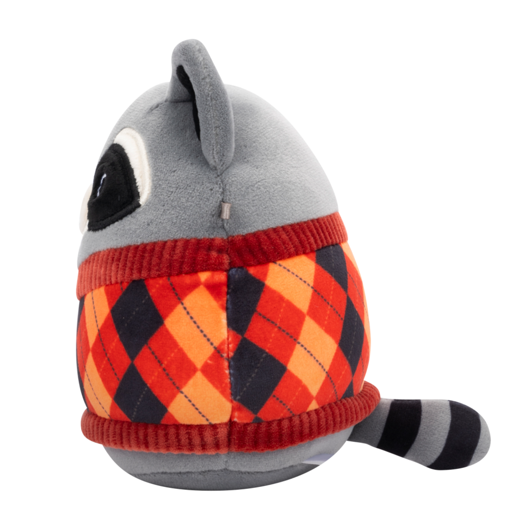 Grey plush toy in side profile, wearing an argyle sweater with red, orange, and dark blue diamonds