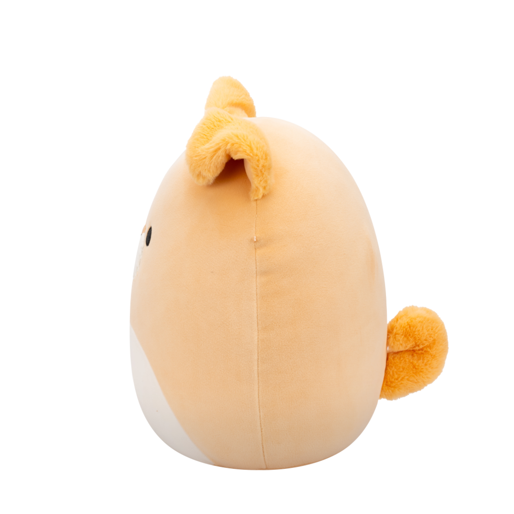 Side view of peach-colored Squishmallow Shiba Inu plush toy with black eyes, white muzzle, embroidered smile, and fuzzy orange ears