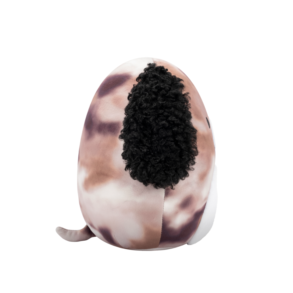 Side view of round plush dog toy with speckled brown body, curly black ears, white belly, and a winking, smiling face