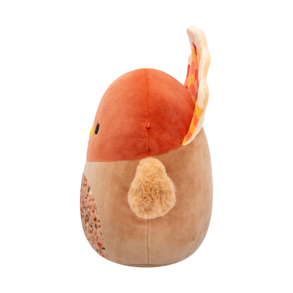 Side veiw of soft brown turkey plush toy with red, orange, yellow tail feathers, black eyes, yellow beak, and an autumn-patterned belly
