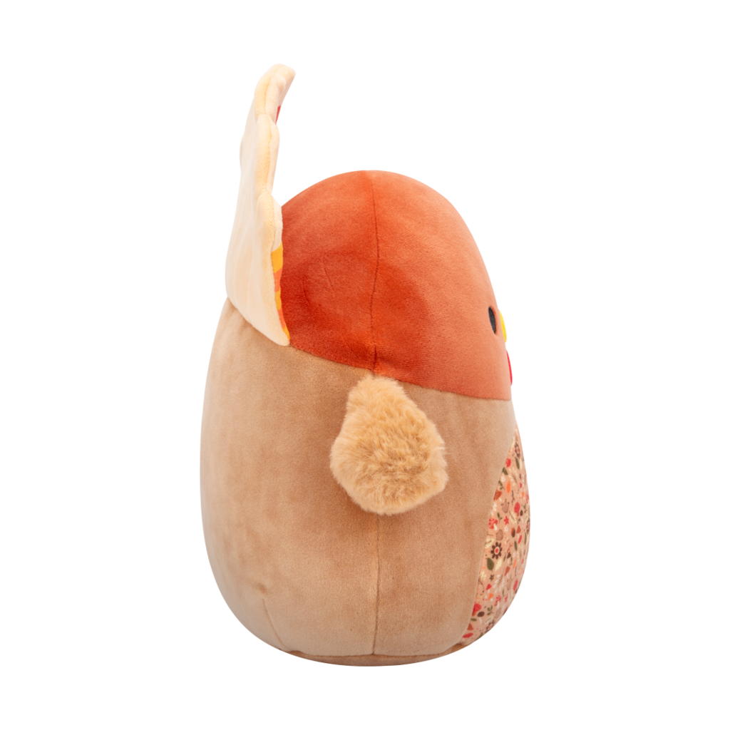 Side veiw of soft brown turkey plush toy with red, orange, yellow tail feathers, black eyes, yellow beak, and an autumn-patterned belly
