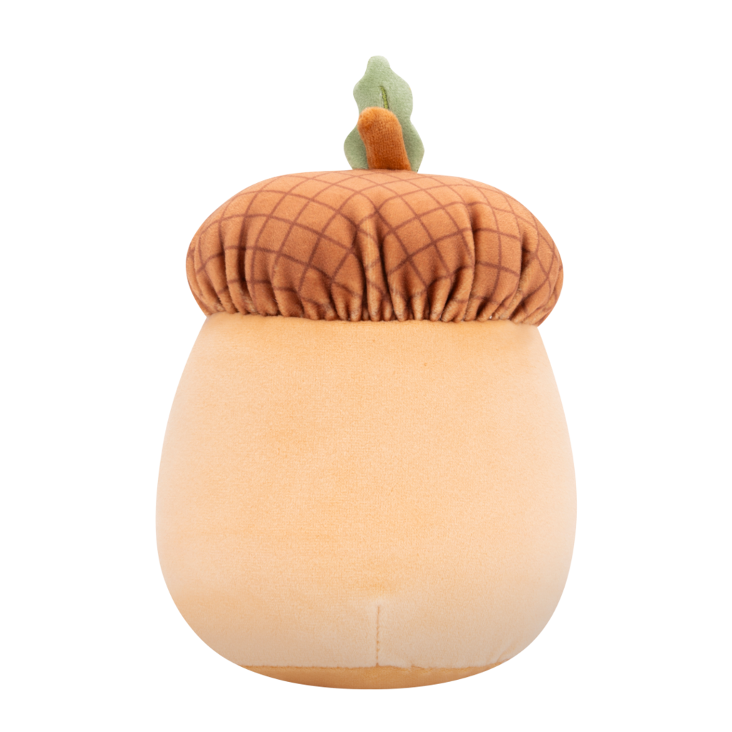 Back view of plush toy with a textured brown cap, green leaf stem, friendly face, and a belly patterned with colorful autumn leaves and mushrooms