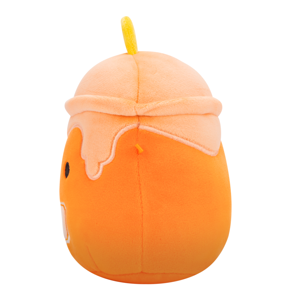 Side view of orange pumpkin-themed plush toy designed as a drink, with light orange whipped cream, yellow straw, cute black eyes, smile, and a pumpkin label on its belly