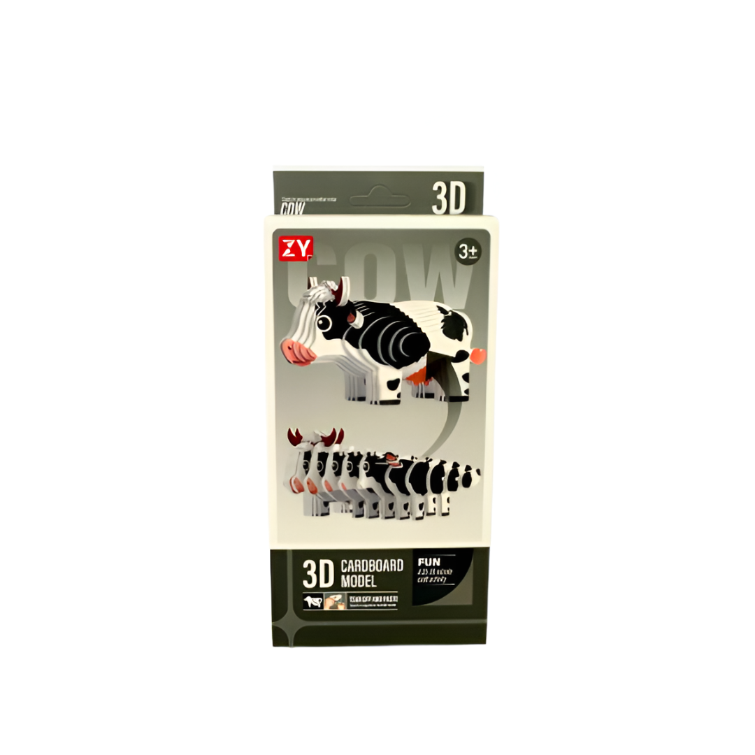 Packaging box displaying a black and white layered 3D cardboard cow model kit