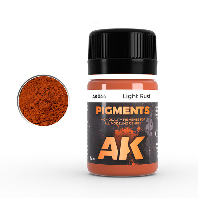 AK Interactive Light Rust pigment bottle with a magnified view of the orange-brown powder