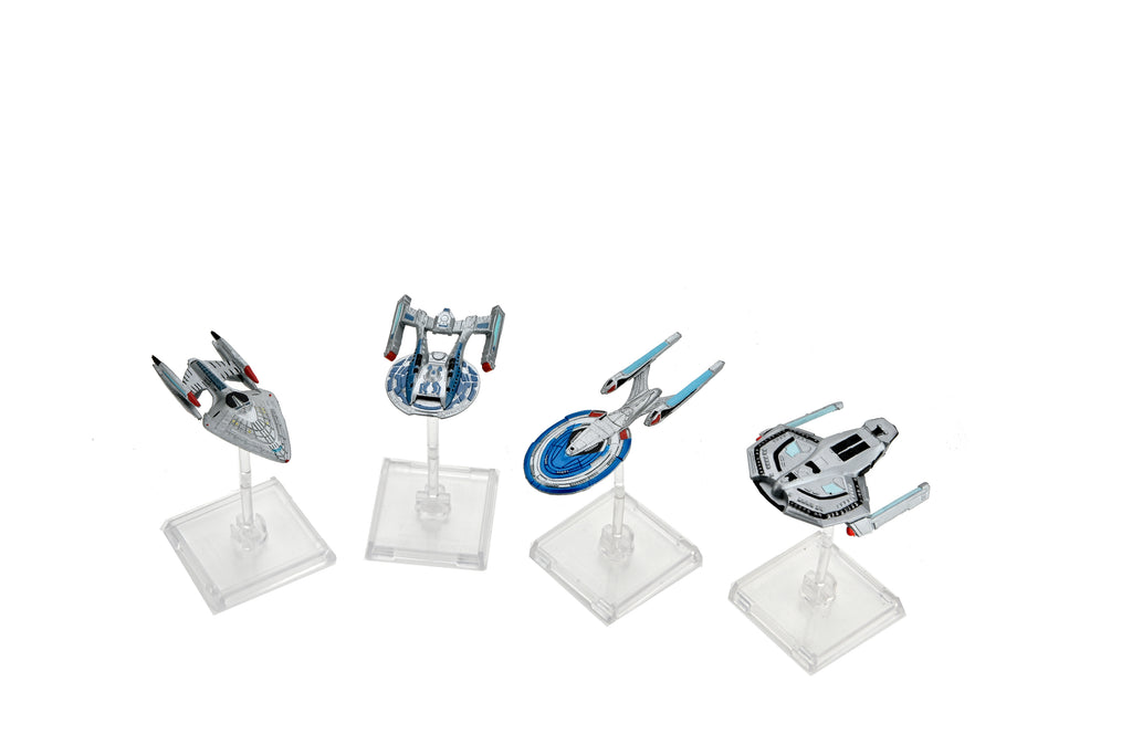 Four detailed Star Trek starship miniatures are displayed on clear stands against a white background