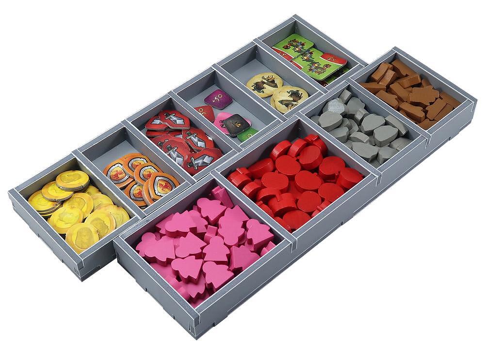 Close-up on a Folded Space organizer compartment with dice and game tokens
