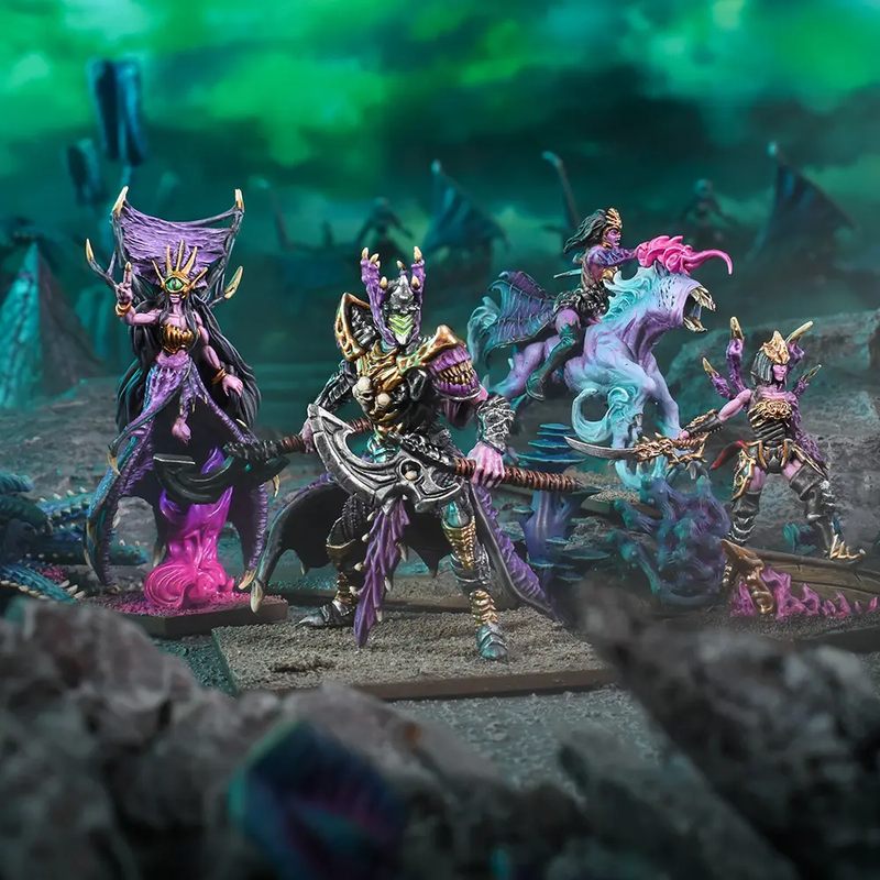 Kings of War Twilight Kin Heroes, painted miniatures in purple, gold, and teal, on rocky terrain base