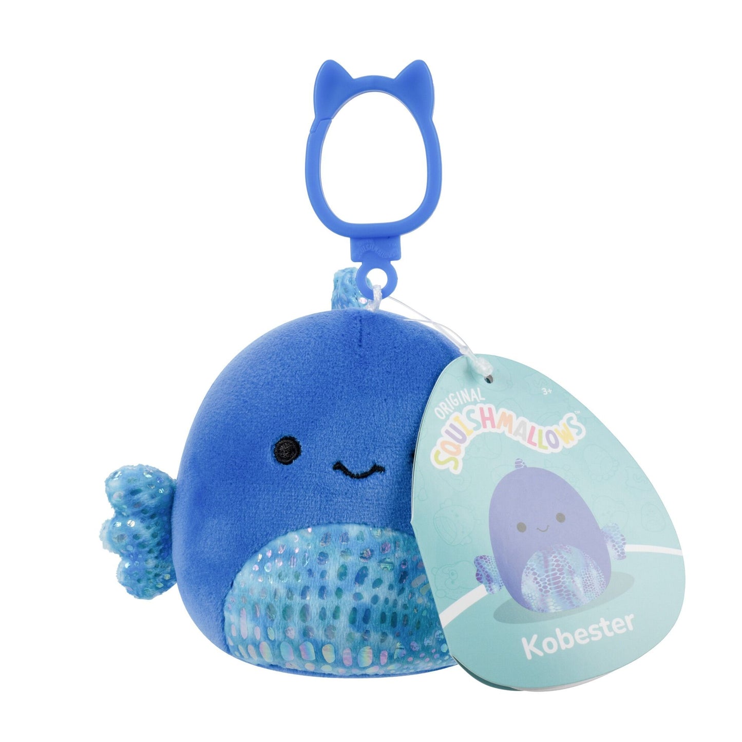 A blue Squishmallows Kobester whale plush keychain with a smiling face, shimmery belly, fins, and a cat-eared clip
