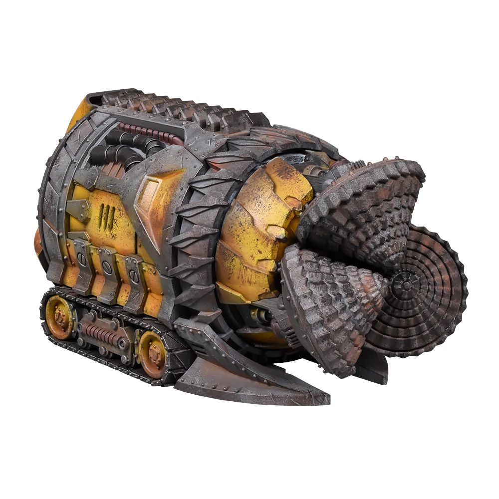 A large, rugged tunneling machine with caterpillar tracks and a massive, rotating drill head in front