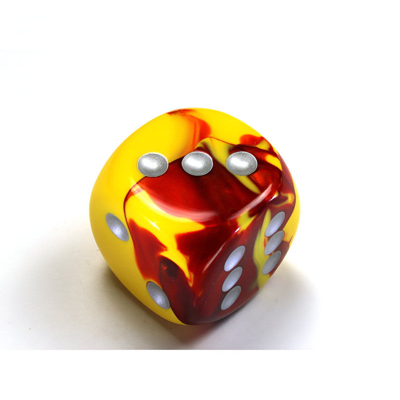 A Chessex Gemini marbled yellow and red d6 dice with silver pips showing 3, 4, and 5